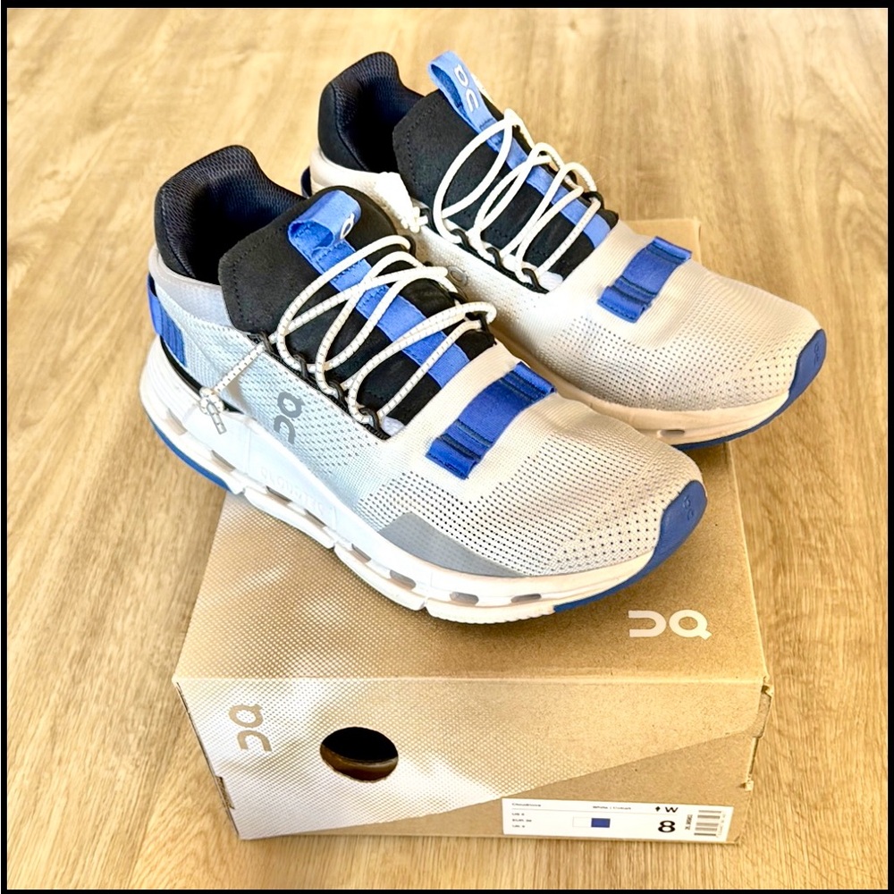 On Running White and Blue Athletic Shoes with Cloud Cushioning